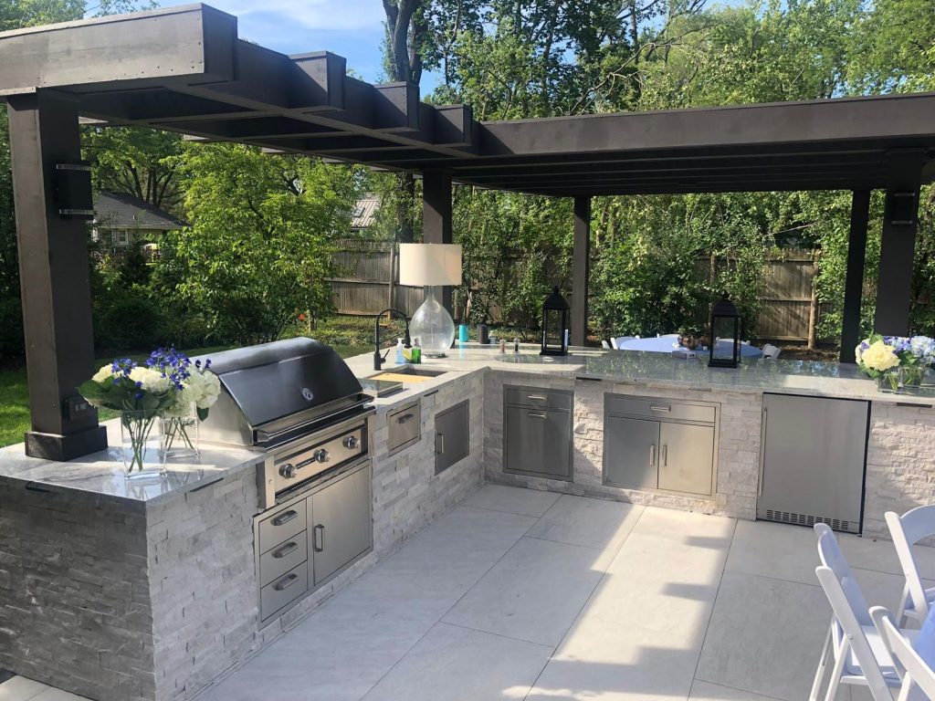 Luxury outdoor kitchen with built-in grill designed and built by American Blue Grass Landscaping in DuPage County, IL