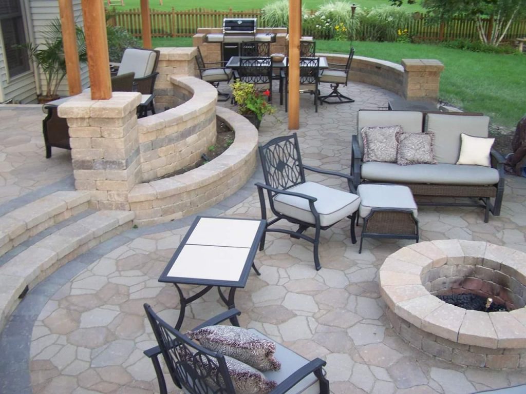 Paver patio with seat walls and fire pit built by American Blue Grass Landscaping