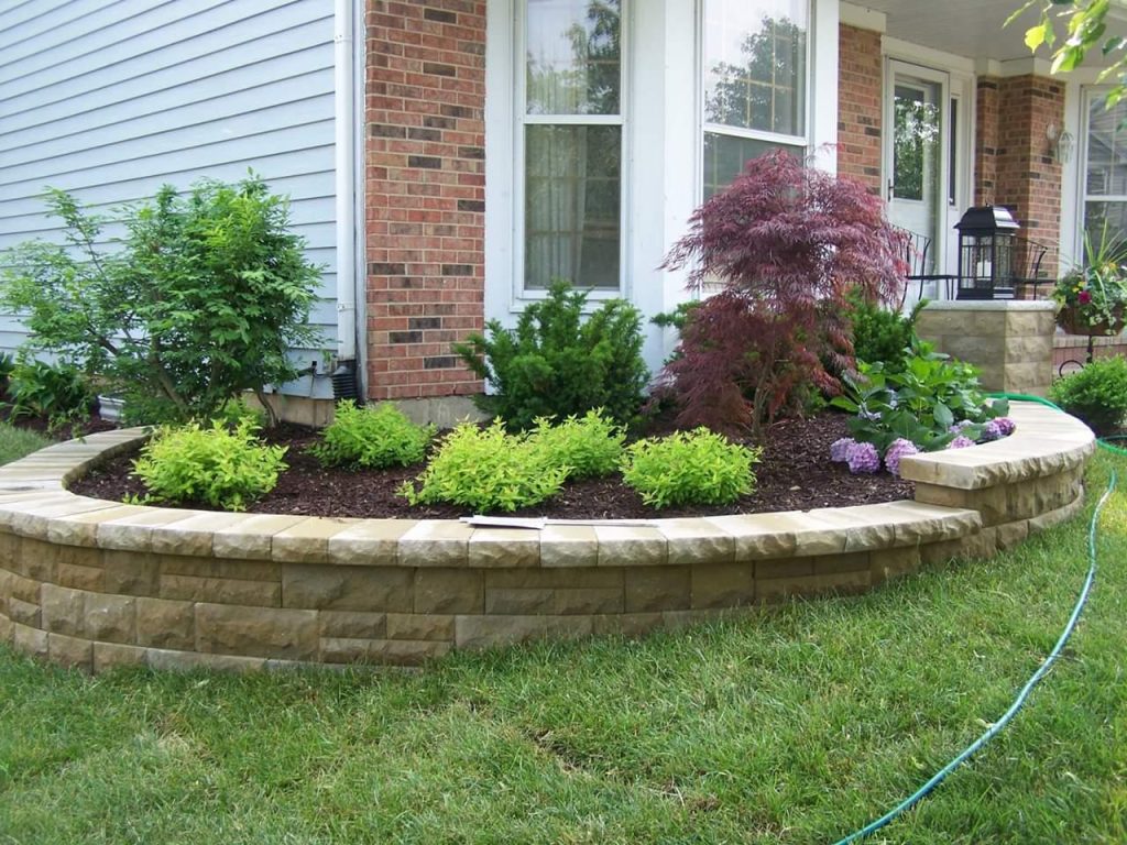 Planting bed and stone retaining wall landscaping in DuPage County, IL